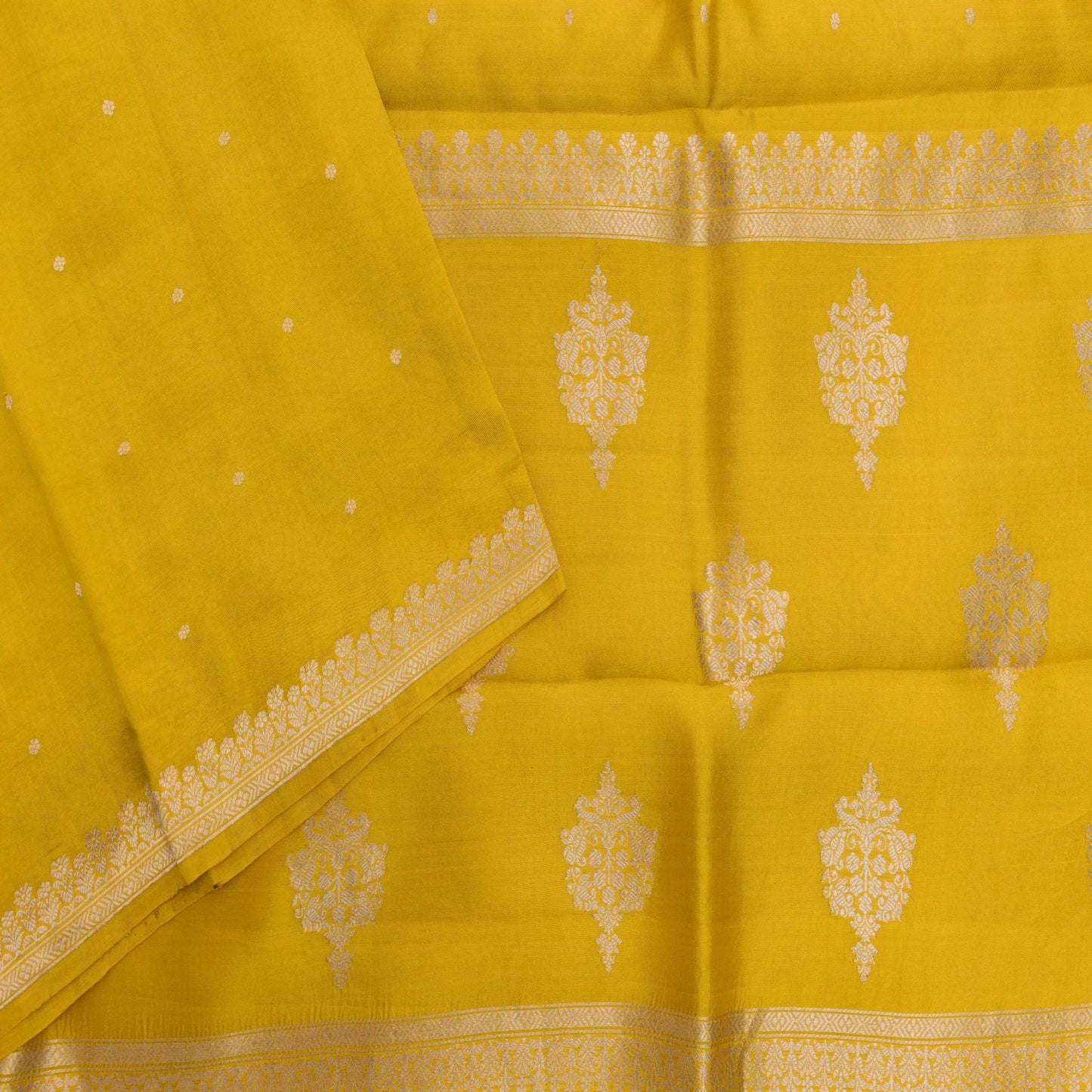 Yellow fabric with white floral patterns and a border