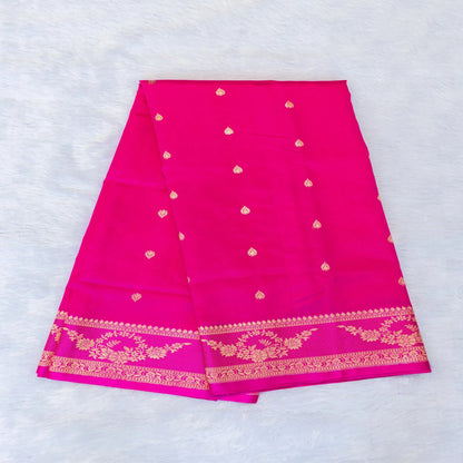 Pink saree with gold patterns on a white background