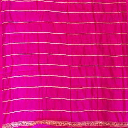 Pink fabric with white vertical stripes and a decorative border