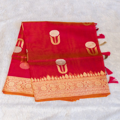 Red fabric with gold patterns on a white background