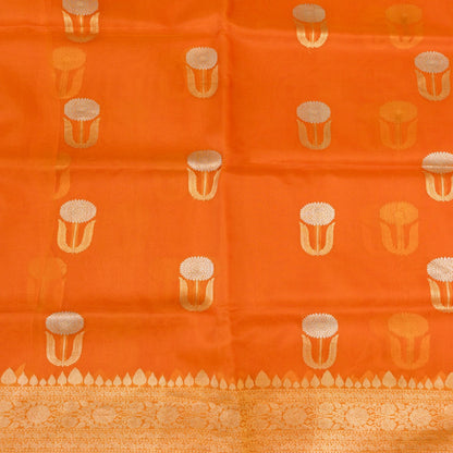 Orange fabric with gold and white pattern