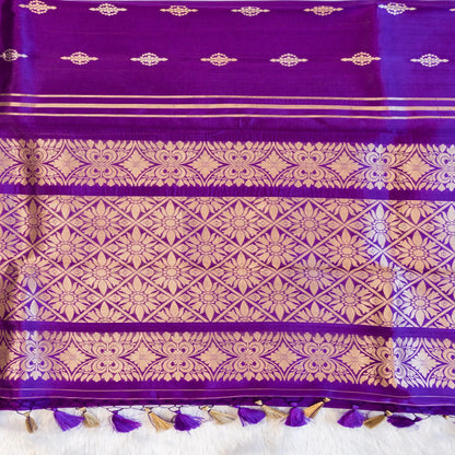 Purple fabric with gold patterns and tassels on a white background