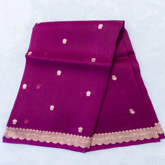 Purple fabric with gold patterns and lace trim on a white background