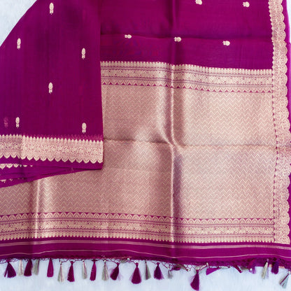 Purple and gold traditional fabric with tassels on a white background