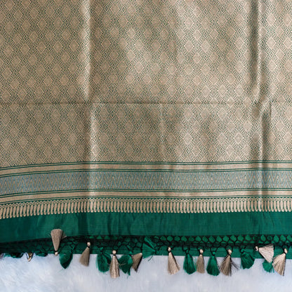Textured fabric with green and beige pattern on a white background