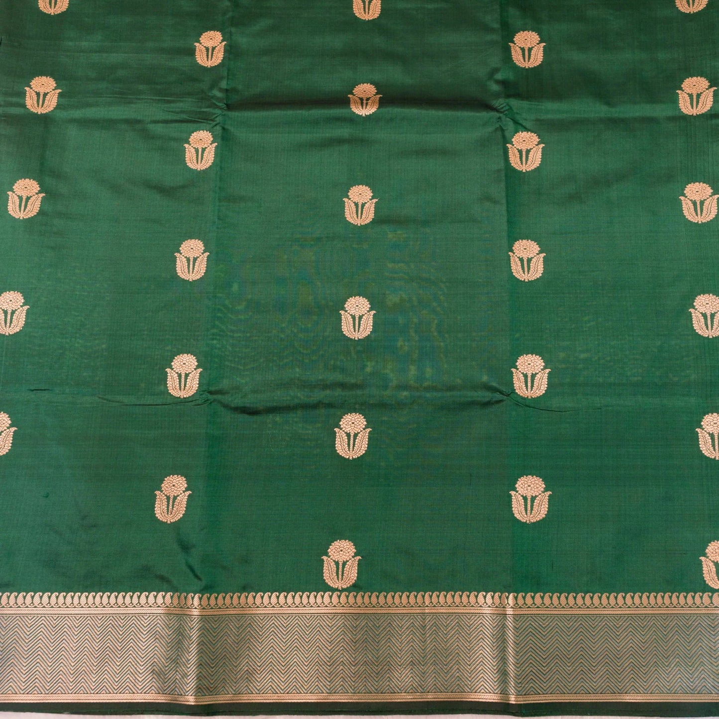 Green fabric with gold patterns