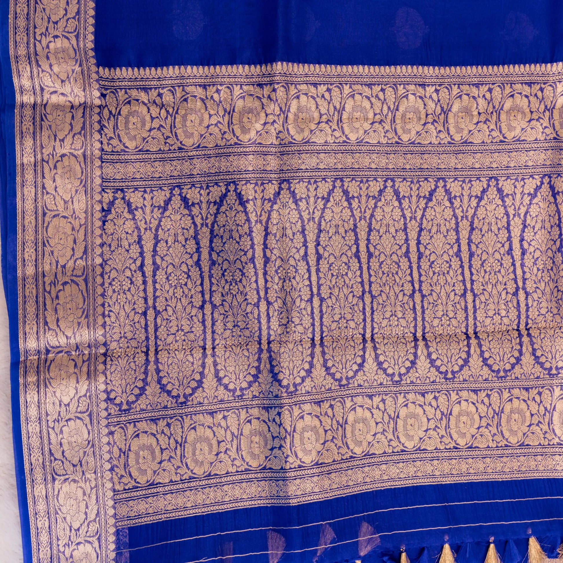 Blue fabric with intricate gold patterns