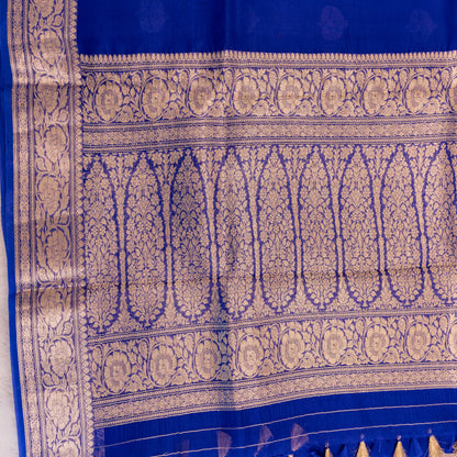 Blue fabric with intricate gold patterns