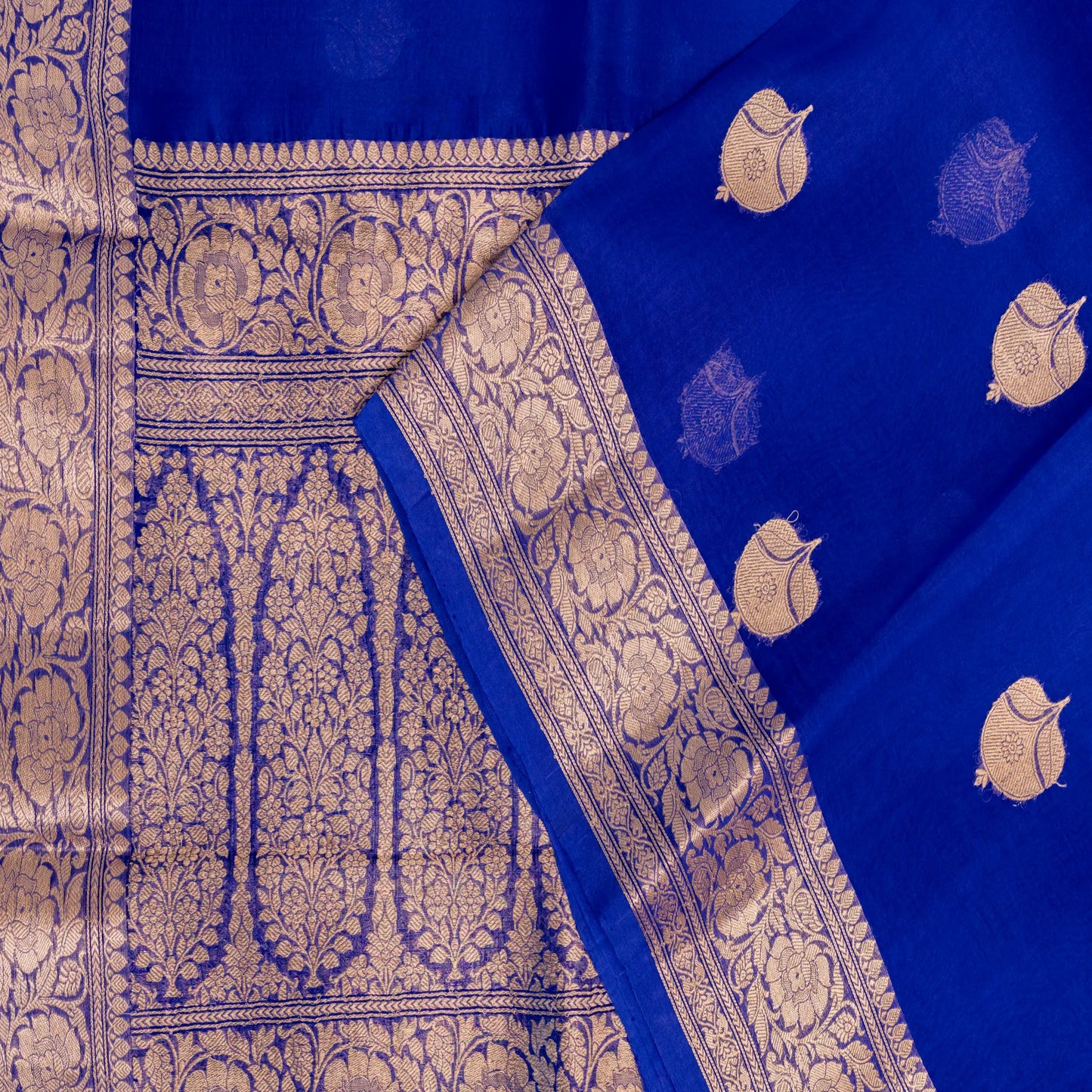 Blue fabric with gold patterns and designs