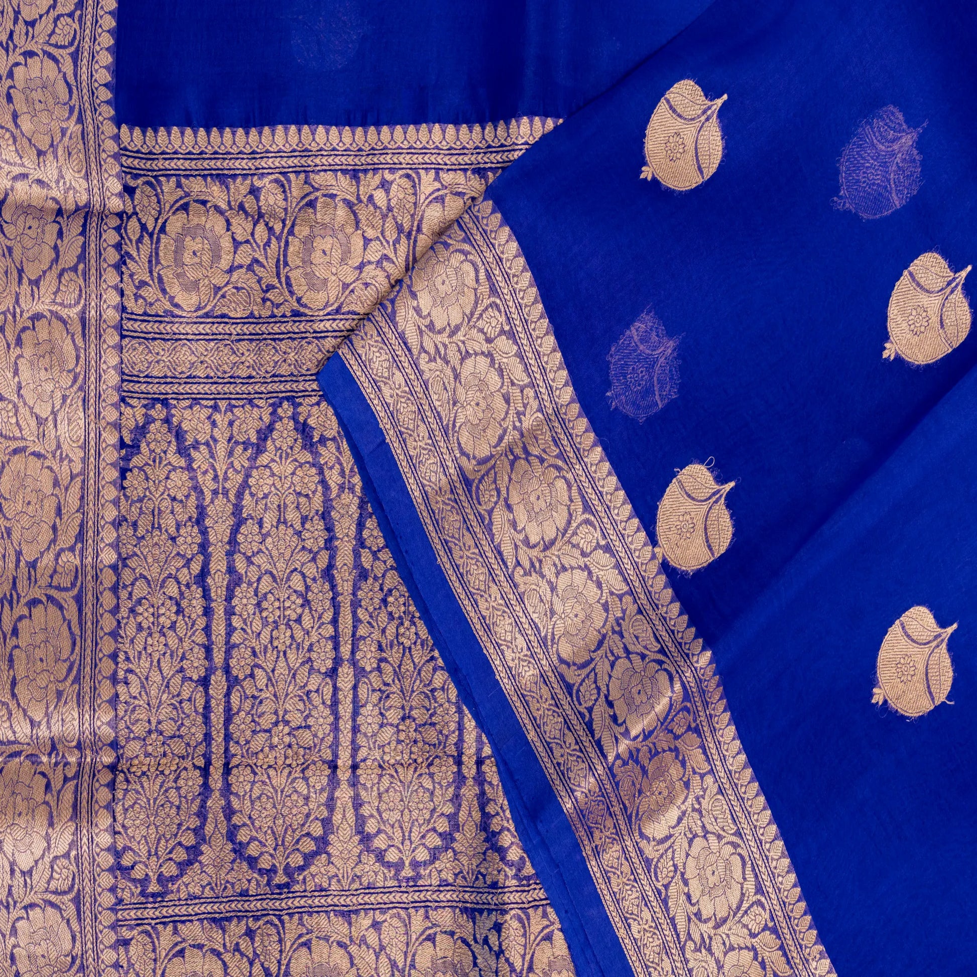 Blue fabric with gold patterns and designs