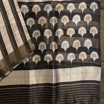 Black saree with white leaf pattern and gold border