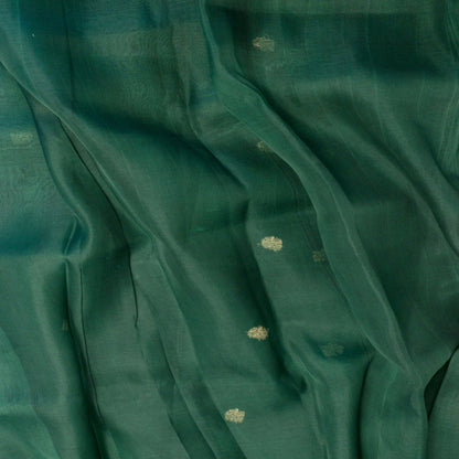 Close-up of teal fabric with subtle patterns