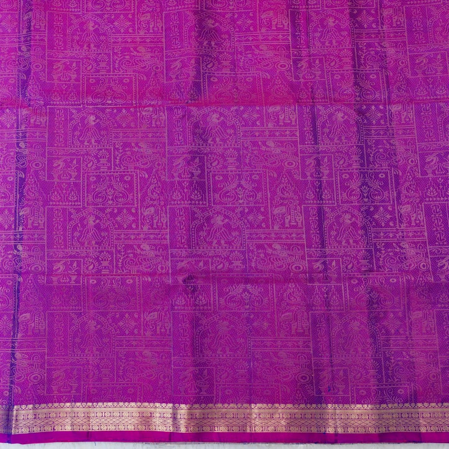 Purple fabric with intricate gold patterns