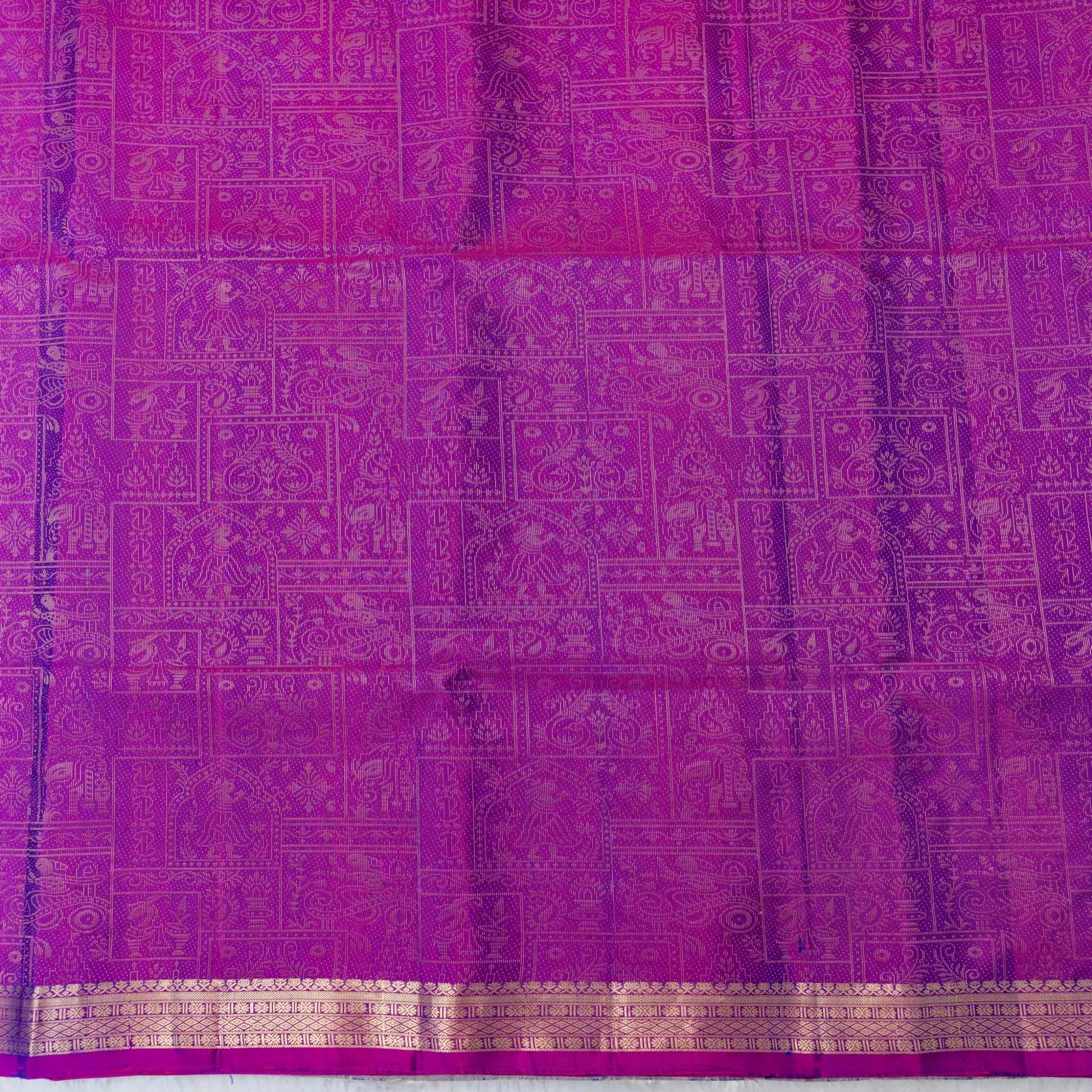 Purple fabric with intricate gold patterns