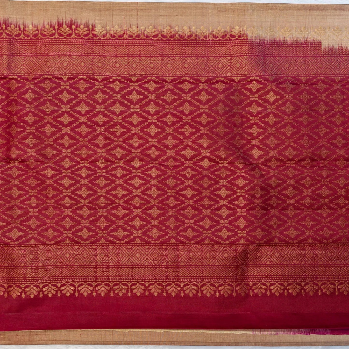Red fabric with gold geometric pattern