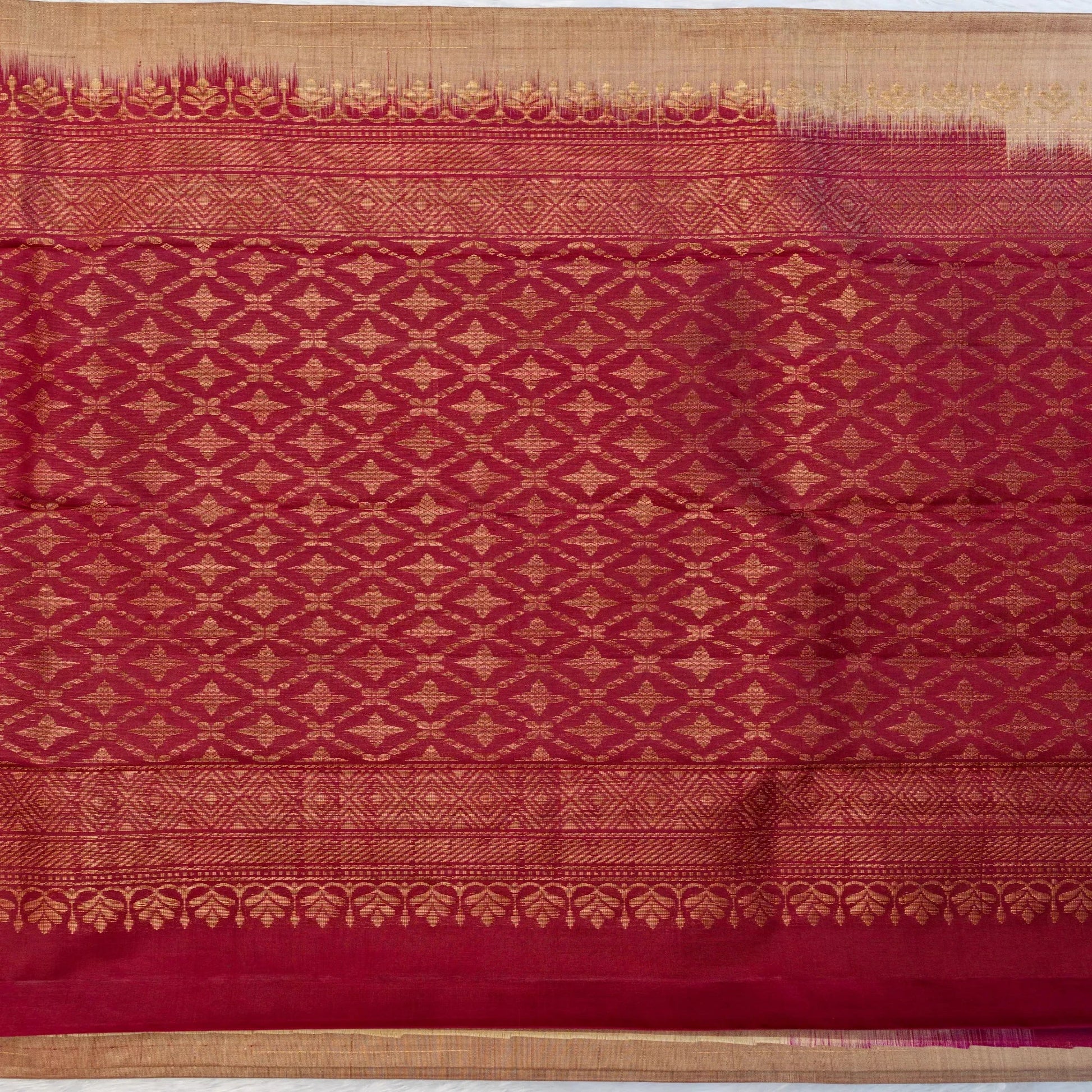 Red fabric with gold geometric pattern
