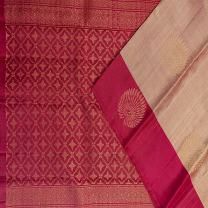 Red and beige saree with intricate patterns