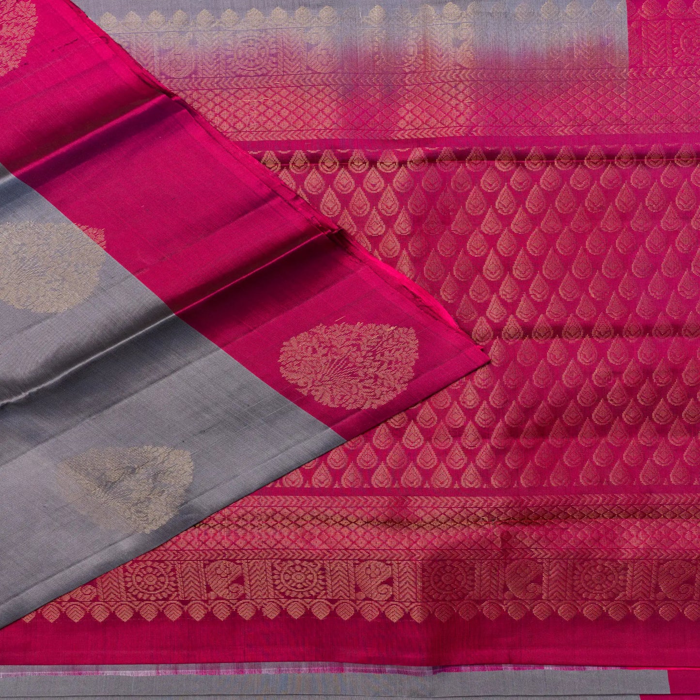 Pink and gray saree with intricate patterns