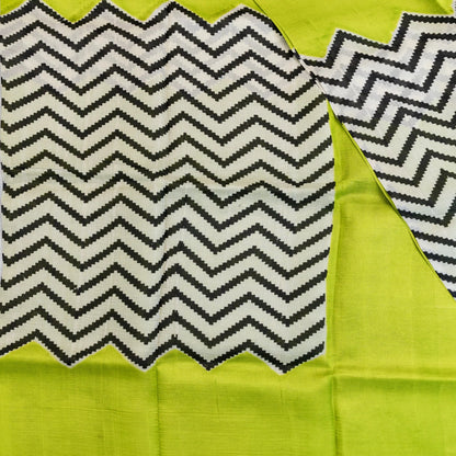 Fabric with a zigzag pattern on a green background