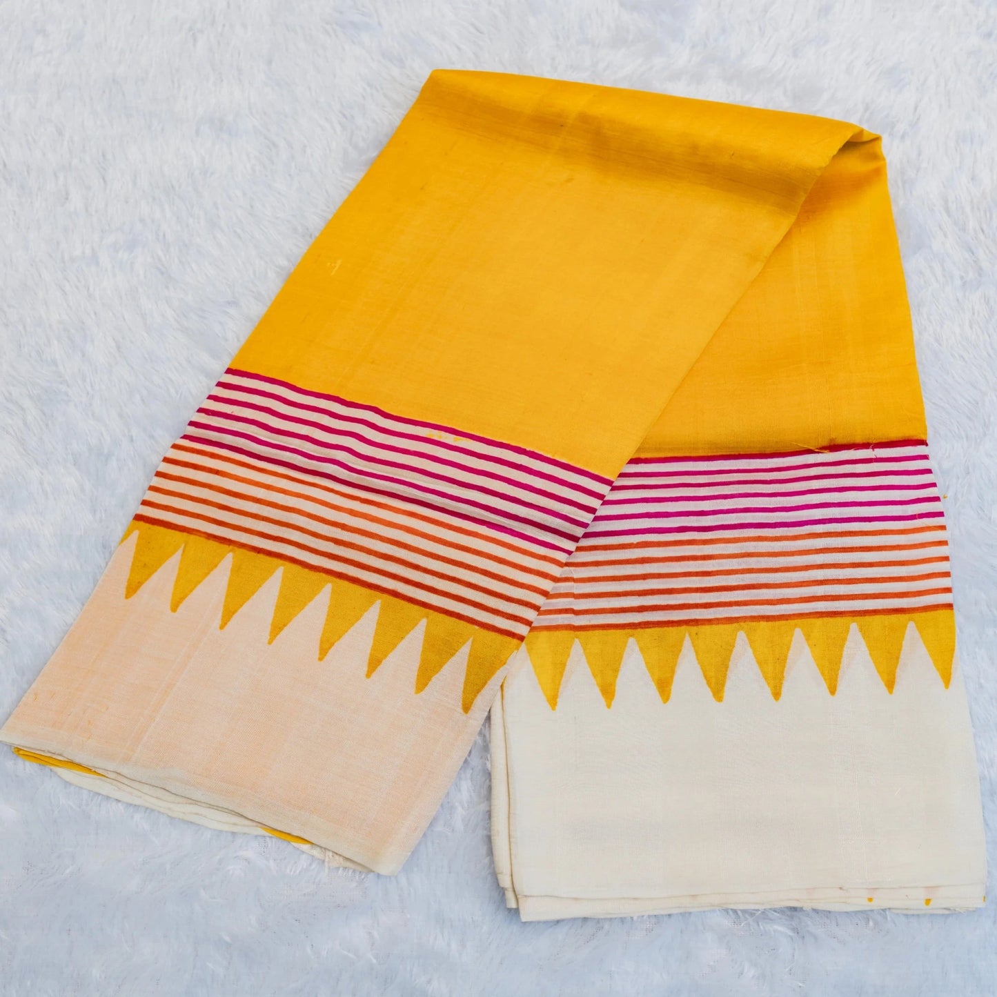 Colorful fabric with geometric patterns on a light gray background