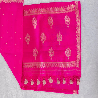 Pink fabric with gold embroidery on a gray background