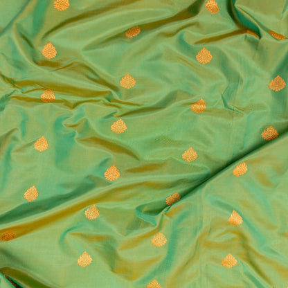 Green fabric with small orange floral patterns