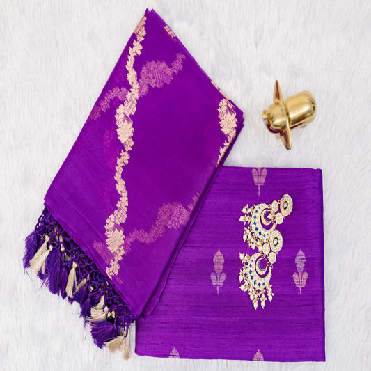 Purple fabric with gold embroidery and tassels on a white background