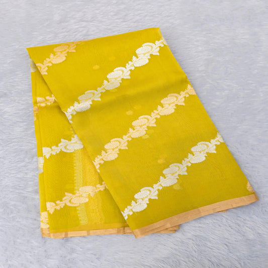 Two yellow napkins with white lace patterns on a light gray background