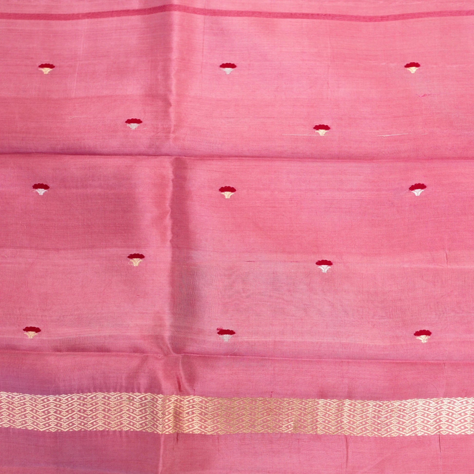 Pink fabric with a subtle pattern and border