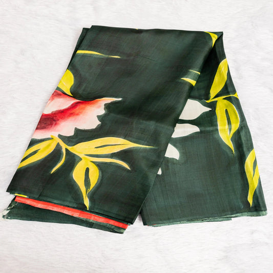 Green fabric with floral and leaf patterns on a white background